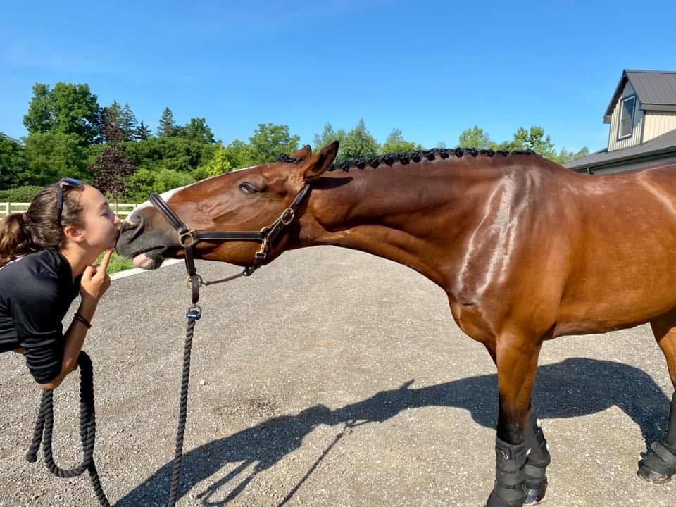 Zara kissing Monkey her horse